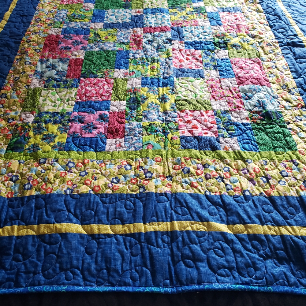 Vibrant Patchwork Quilt with Blue and Yellow Accents